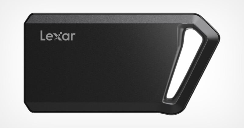 A black Lexar portable SSD with a sleek design and an angled, integrated keying hole on one side. Brand name "Lecture" Printed in the upper left corner. The SSD has a modern, compact look.