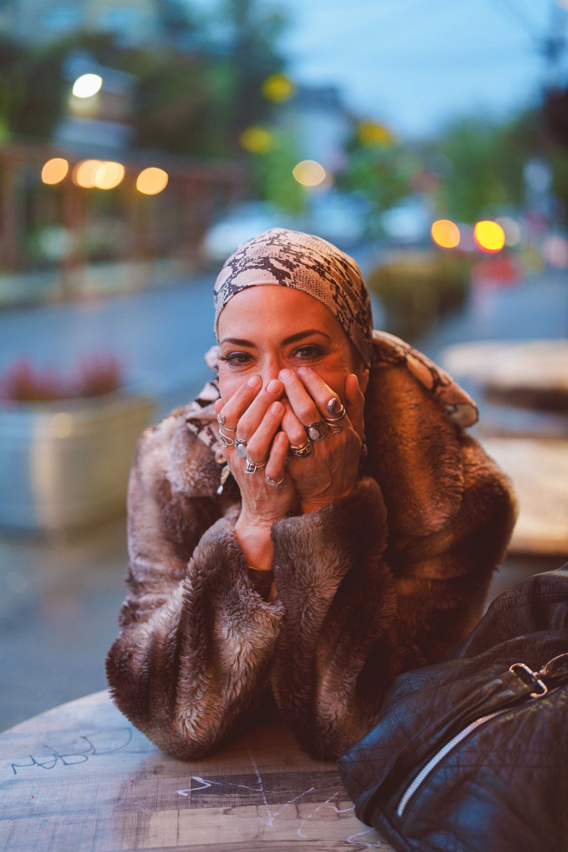 Eliuk's playful spirit shines through as she hides her smile with her hands.
